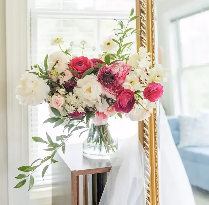 Centerpiece vessel showcasing seasonal flowers for a spring wedding