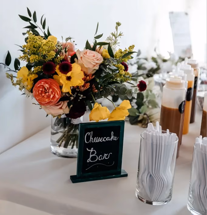 Centerpiece featuring refreshing citrus tones of wedding flowers