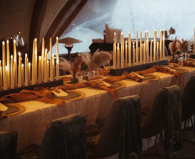 A tablescape with summer flower color palette and candles