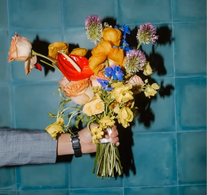 Multiple wedding flower color schemes fused in a rainbow bouquet