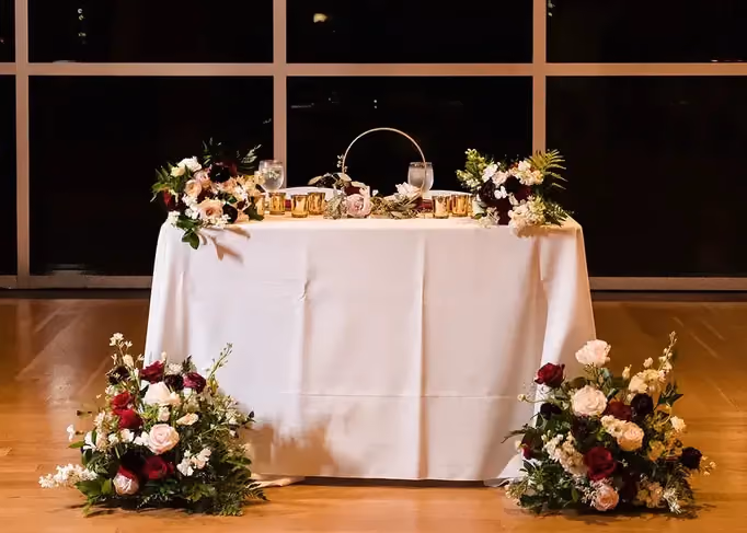 A tablescape showcasing Poppy’s Bordeaux floral palette