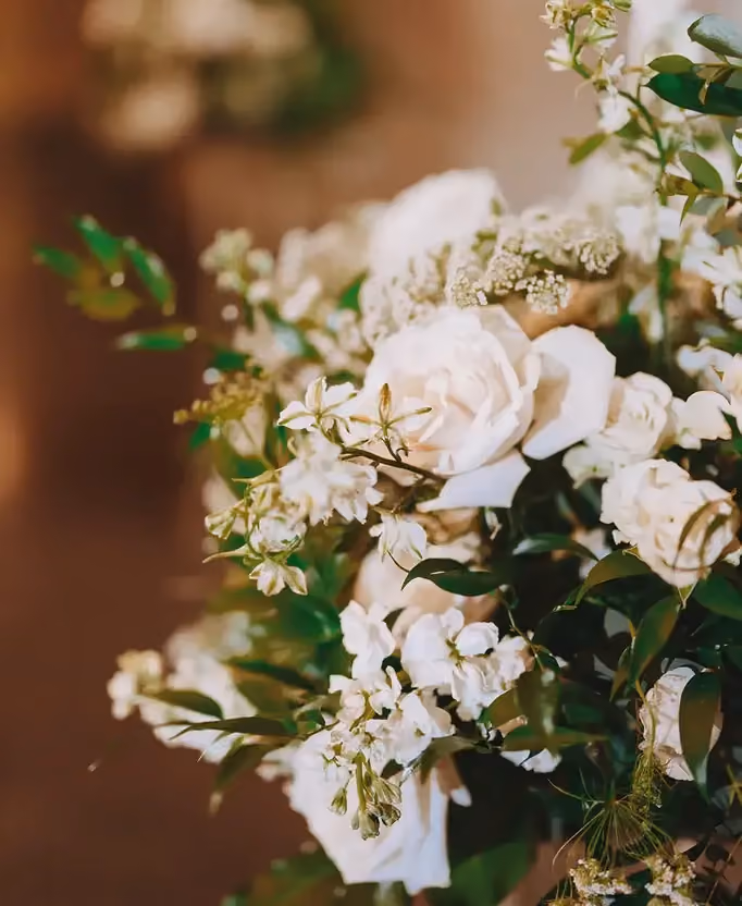 Floral arrangement exhibiting white winter flower color palette