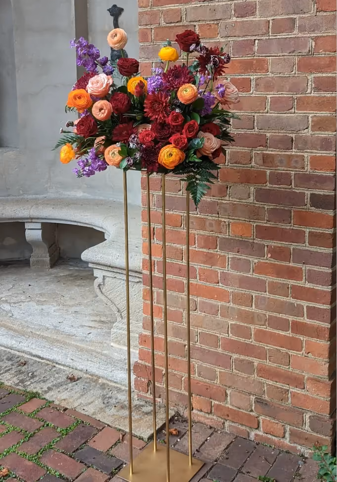 Arrangement displaying jewel-toned wedding flower color palette