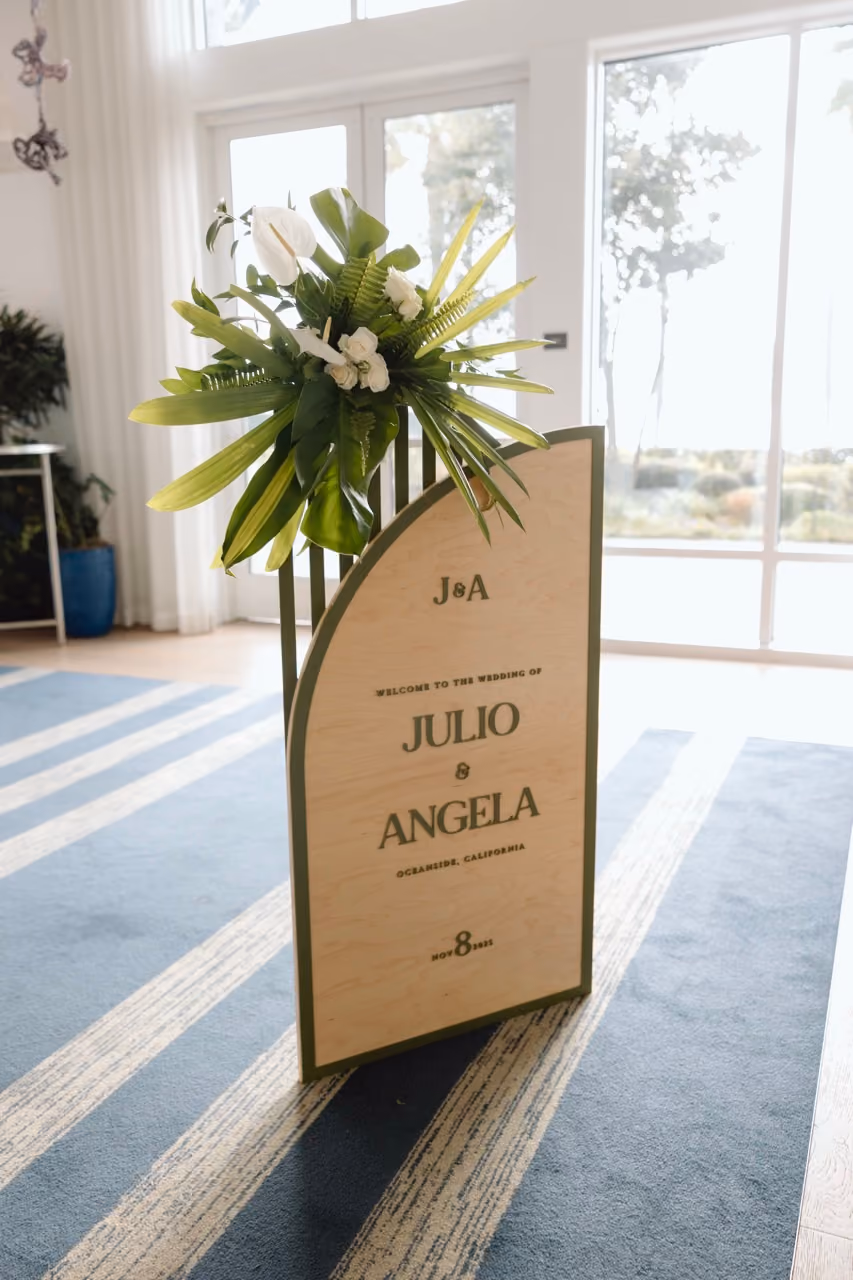 White oriental lily and palm frond wedding arrangements for Oceanside California wedding