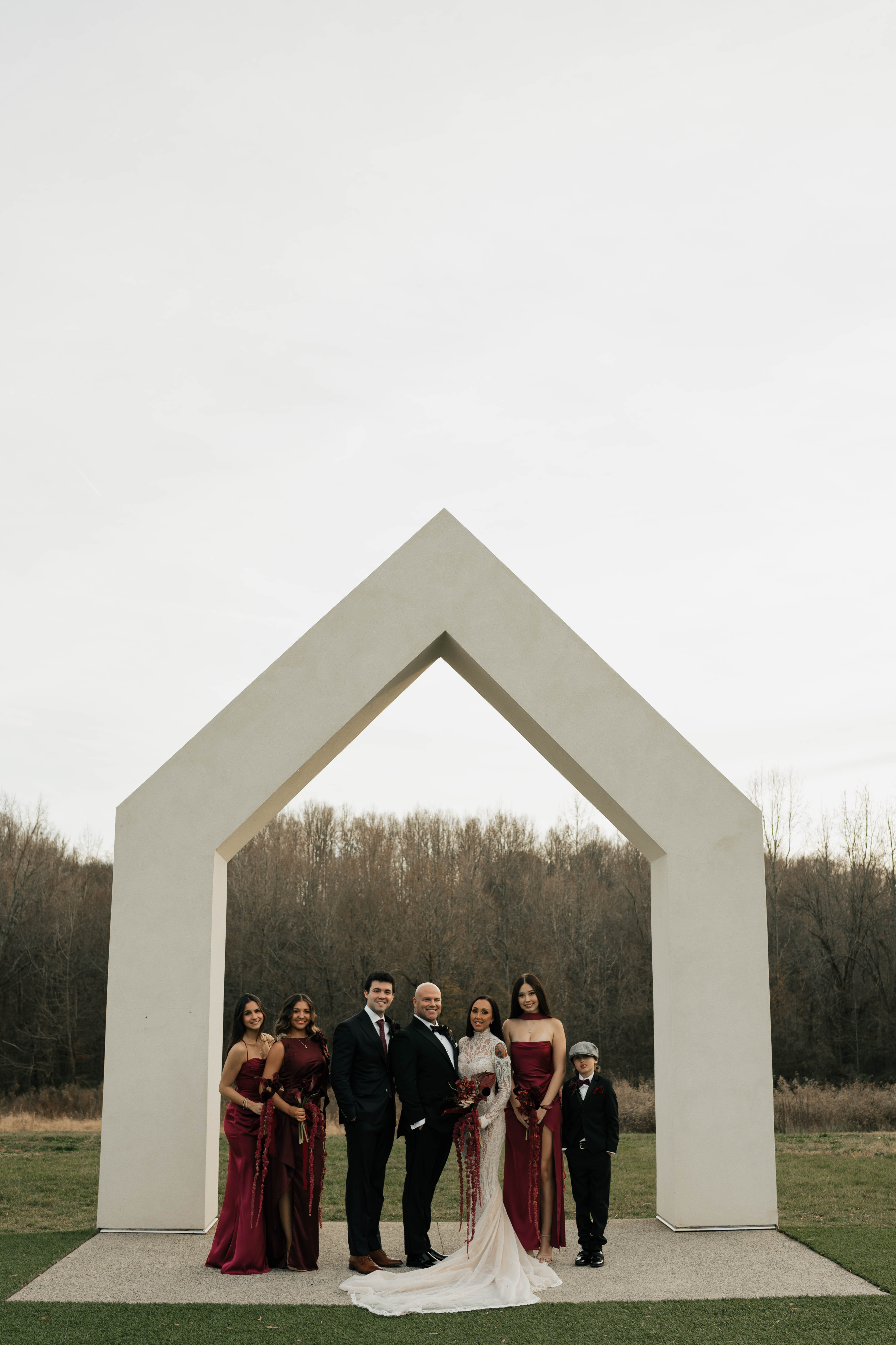 Wedding ceremony setup at The Lumen House with moody romantic flower arrangements