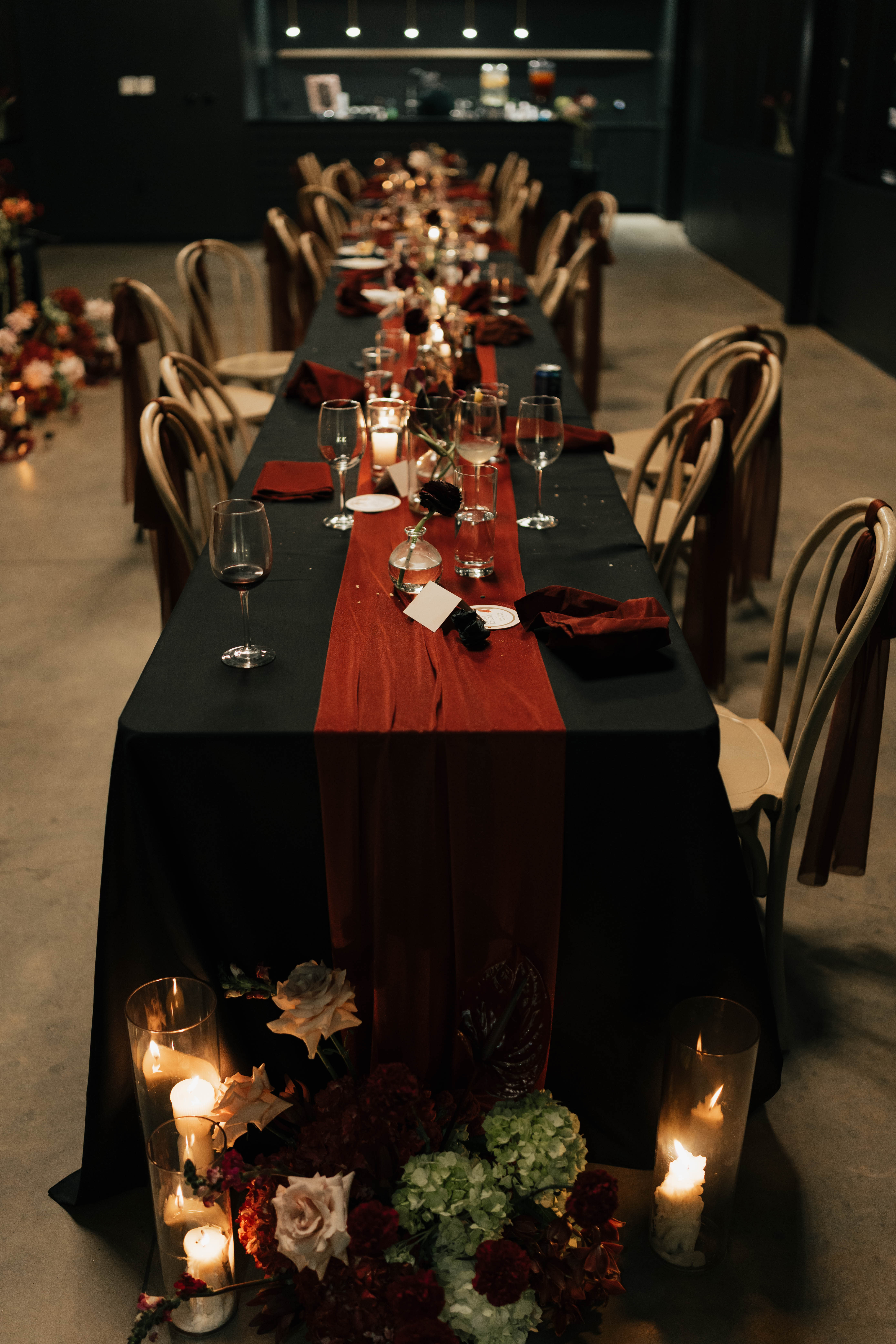 Organic, textural wedding flower arrangement in dark romantic color palette
