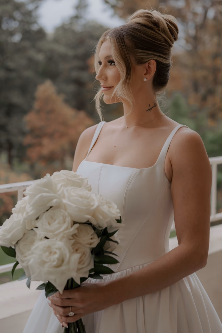 Bride holding classic white bouquet at Wadsworth Mansion wedding