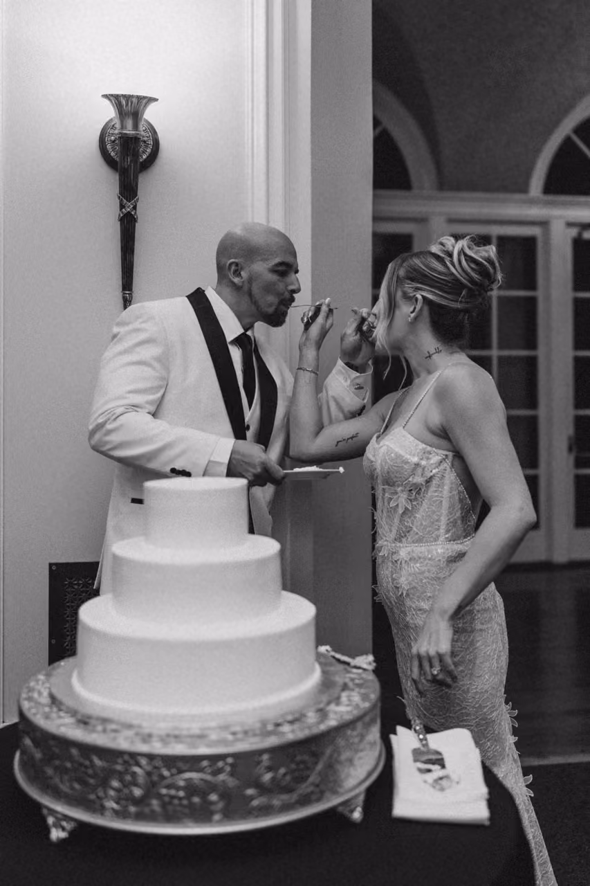 Classic wedding cake cutting moment