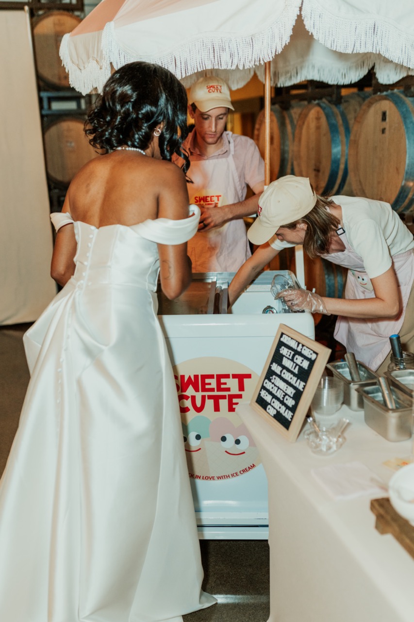 Bride visiting a sweets cart during the reception at Callaway Vineyard & Winery