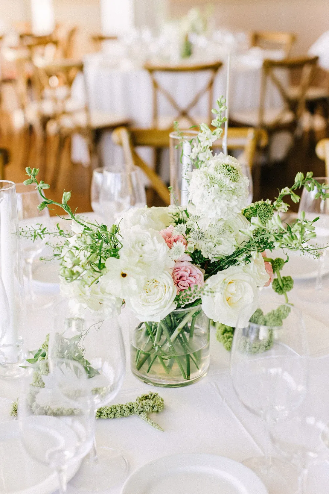 White and blush rose centerpiece on a reception table at Peconic Bay Yacht Club